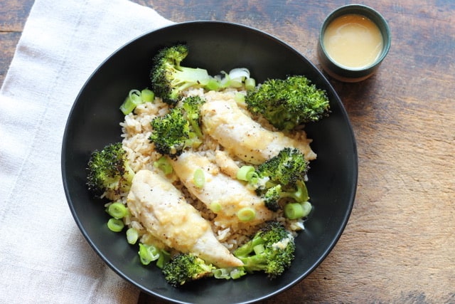 miso ginger chicken on table with dressing