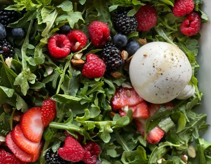 Arugula Burrata Salad with Berries close up